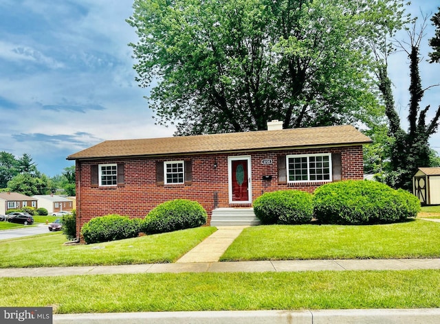 6728 Yataruba Dr, Baltimore, MD 21207 - view of front of property with brick siding, a chimney, and a front lawn
