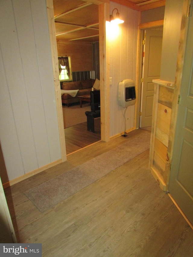 293 Snow Shoe Mountain Forest Rd, Snow Shoe, PA 16874 - hall with wood finished floors, wood walls, and heating unit