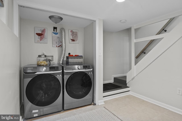 5117 Duel Pl, Capitol Heights, MD 20743 - laundry room featuring washer and clothes dryer and baseboards