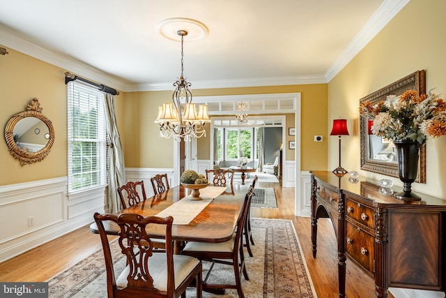 4 Taylor Chase Ln, West Chester, PA 19382 - dining room with light wood-style floors, plenty of natural light, a chandelier, wainscoting, and ornamental molding