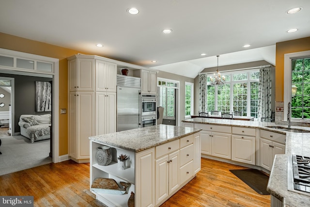 4 Taylor Chase Ln, West Chester, PA 19382 - kitchen with open shelves, appliances with stainless steel finishes, recessed lighting, a chandelier, and a center island