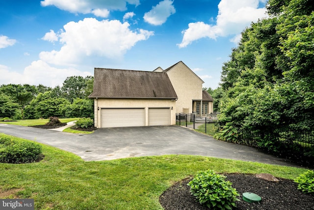 4 Taylor Chase Ln, West Chester, PA 19382 - view of front of home with asphalt driveway, an attached garage, stucco siding, and roof with shingles