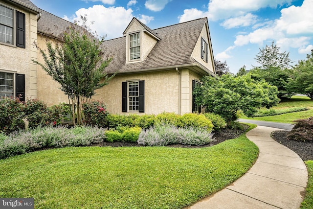 4 Taylor Chase Ln, West Chester, PA 19382 - view of property exterior featuring stucco siding, a yard, and roof with shingles