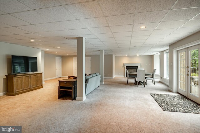 4 Taylor Chase Ln, West Chester, PA 19382 - below grade area featuring light carpet, a fireplace, recessed lighting, french doors, and a drop ceiling