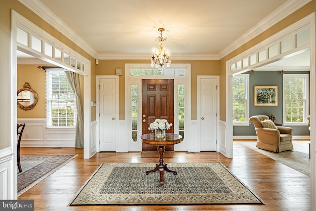 4 Taylor Chase Ln, West Chester, PA 19382 - foyer featuring a chandelier, wood finished floors, ornamental molding, and wainscoting
