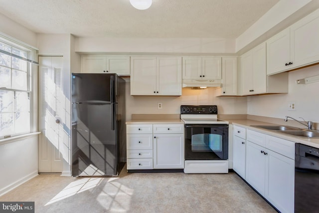 8 Tatler Pl, Owings Mills, MD 21117 - kitchen with black appliances, under cabinet range hood, a textured ceiling, light countertops, and white cabinetry