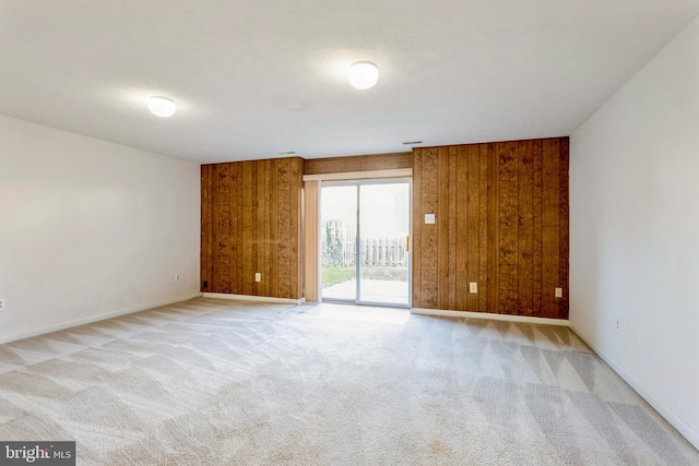 8 Tatler Pl, Owings Mills, MD 21117 - empty room featuring wooden walls and light colored carpet