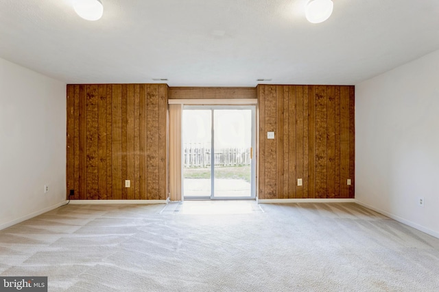 8 Tatler Pl, Owings Mills, MD 21117 - spare room with wood walls and carpet floors
