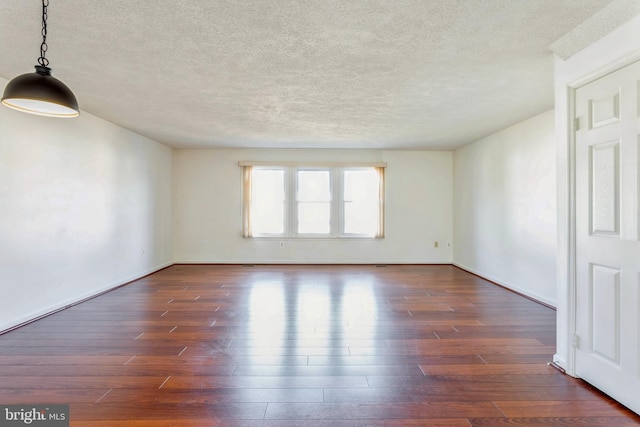 8 Tatler Pl, Owings Mills, MD 21117 - spare room with dark wood-style flooring and a textured ceiling