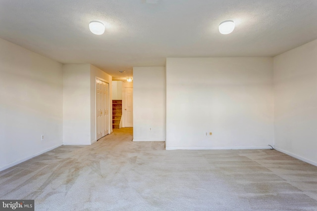 8 Tatler Pl, Owings Mills, MD 21117 - empty room featuring light carpet and a textured ceiling