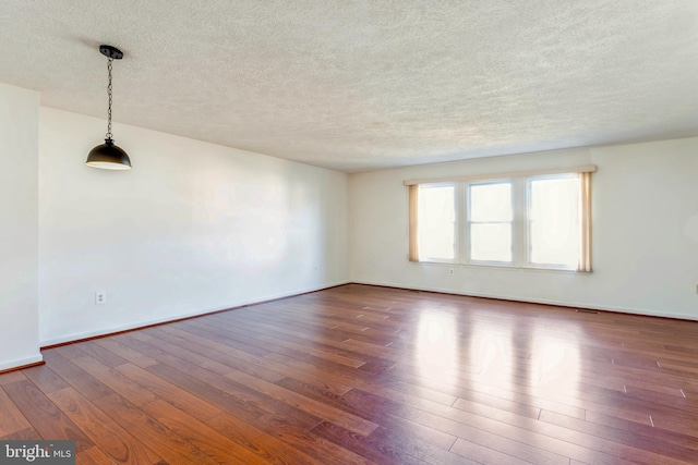 8 Tatler Pl, Owings Mills, MD 21117 - unfurnished room featuring wood finished floors and a textured ceiling