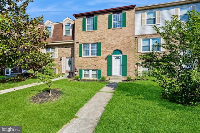 8 Tatler Pl, Owings Mills, MD 21117 - townhome / multi-family property with brick siding and a front lawn