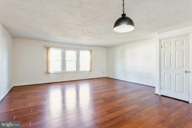 8 Tatler Pl, Owings Mills, MD 21117 - empty room featuring a textured ceiling and wood finished floors