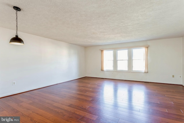 8 Tatler Pl, Owings Mills, MD 21117 - empty room with a textured ceiling and dark wood-type flooring
