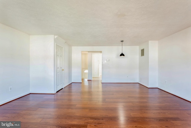 8 Tatler Pl, Owings Mills, MD 21117 - empty room featuring wood-type flooring and a textured ceiling
