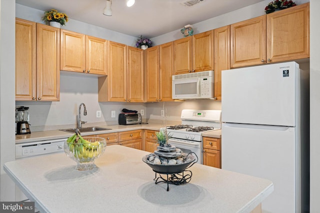 9480 Virginia Center Blvd Unit 327, Vienna, VA 22181 - kitchen with white appliances, light countertops, light brown cabinets, and a center island