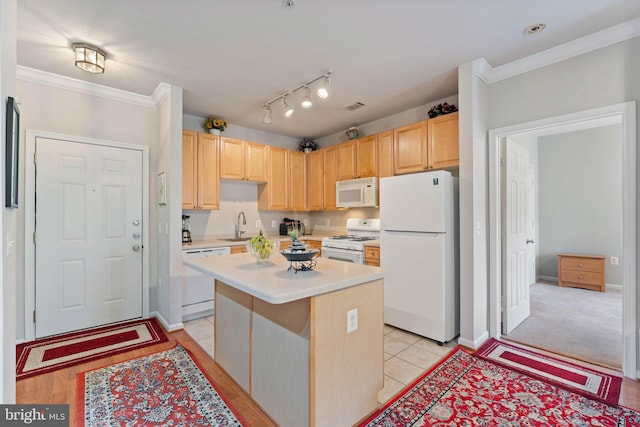 9480 Virginia Center Blvd Unit 327, Vienna, VA 22181 - kitchen with white appliances, light brown cabinets, light countertops, a kitchen island, and ornamental molding