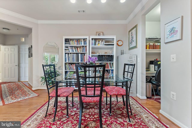 9480 Virginia Center Blvd Unit 327, Vienna, VA 22181 - dining room featuring wood finished floors, crown molding, and a desk