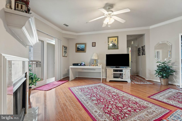 9480 Virginia Center Blvd Unit 327, Vienna, VA 22181 - living room with wood finished floors, a ceiling fan, crown molding, and a high end fireplace