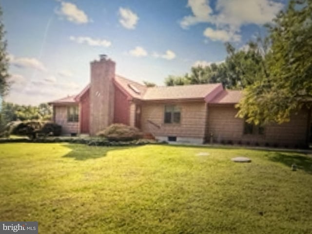 114 Lloyd Guessford Rd, Townsend, DE 19734 - view of side of property featuring a chimney and a lawn