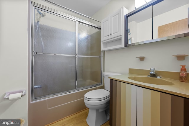114 Lloyd Guessford Rd, Townsend, DE 19734 - bathroom featuring vanity, enclosed tub / shower combo, and wood finished floors
