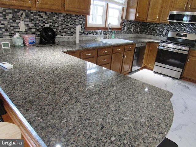 3590 Choptank Rd, Preston, MD 21655 - kitchen with appliances with stainless steel finishes, brown cabinets, backsplash, and light marble finish floors