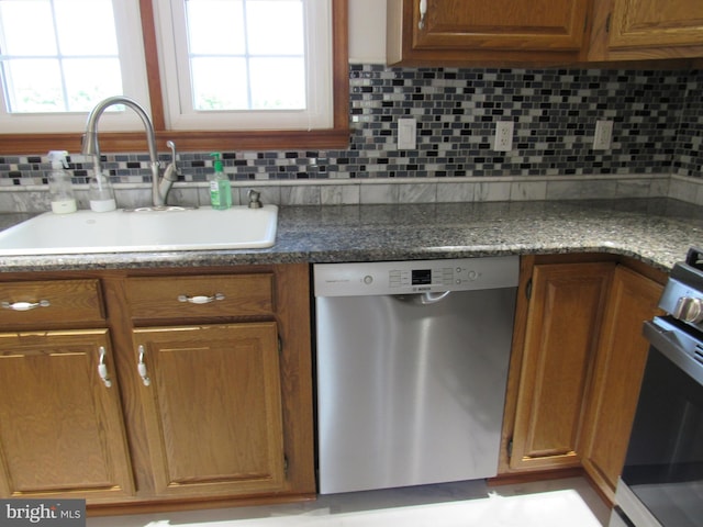 3590 Choptank Rd, Preston, MD 21655 - kitchen with stainless steel appliances, backsplash, and brown cabinets