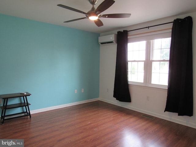 3590 Choptank Rd, Preston, MD 21655 - empty room featuring a wall mounted AC, ceiling fan, and dark wood finished floors