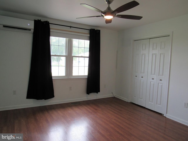 3590 Choptank Rd, Preston, MD 21655 - unfurnished bedroom with a wall unit AC, wood finished floors, a closet, and ceiling fan