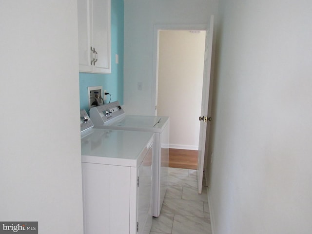 3590 Choptank Rd, Preston, MD 21655 - washroom with cabinet space, separate washer and dryer, and light marble finish floors