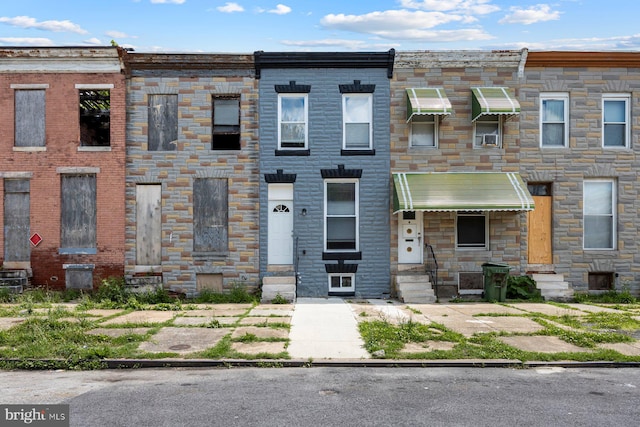 1955 N Collington Ave, Baltimore, MD 21213 - townhome / multi-family property with entry steps and stone siding