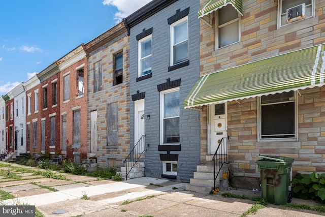 1955 N Collington Ave, Baltimore, MD 21213 - townhome / multi-family property featuring entry steps and stone siding