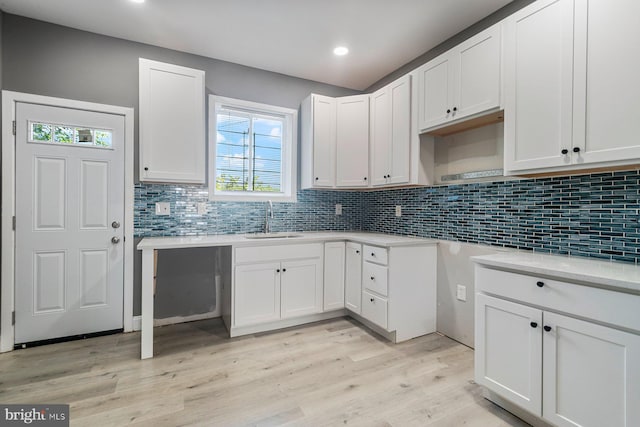 1955 N Collington Ave, Baltimore, MD 21213 - kitchen with healthy amount of natural light, light wood-type flooring, tasteful backsplash, and recessed lighting