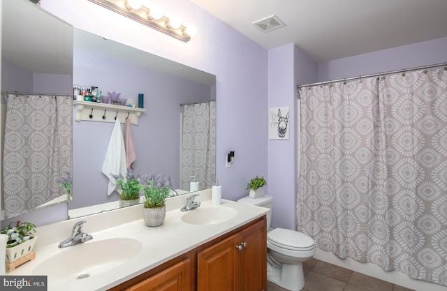1905 Reading Blvd, Reading, PA 19609 - full bathroom with double vanity, tile patterned floors, and a shower with curtain