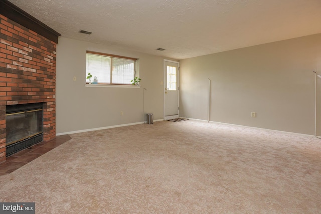 11 Bryce Ct, Baltimore, MD 21236 - unfurnished living room featuring carpet flooring, a brick fireplace, and a textured ceiling