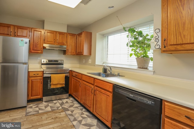 11 Bryce Ct, Baltimore, MD 21236 - kitchen with appliances with stainless steel finishes, under cabinet range hood, light countertops, and brown cabinets