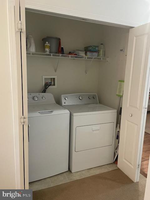 103 Raphael Ct, Williamstown, NJ 08094 - laundry area with washing machine and clothes dryer and light tile patterned floors