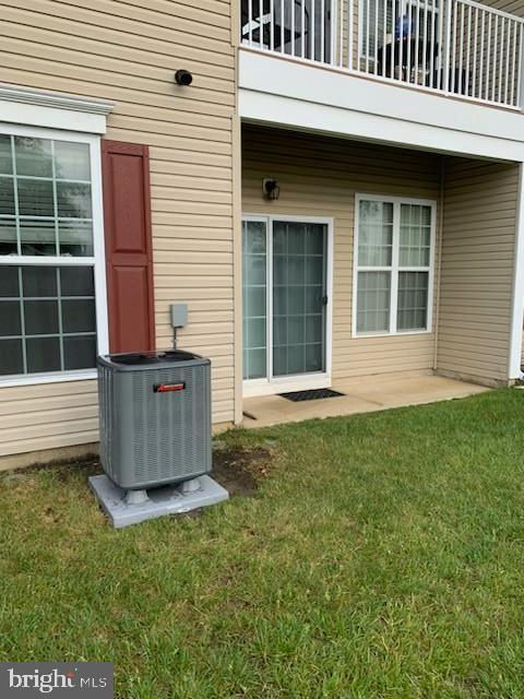 103 Raphael Ct, Williamstown, NJ 08094 - view of exterior entry with a balcony and a yard