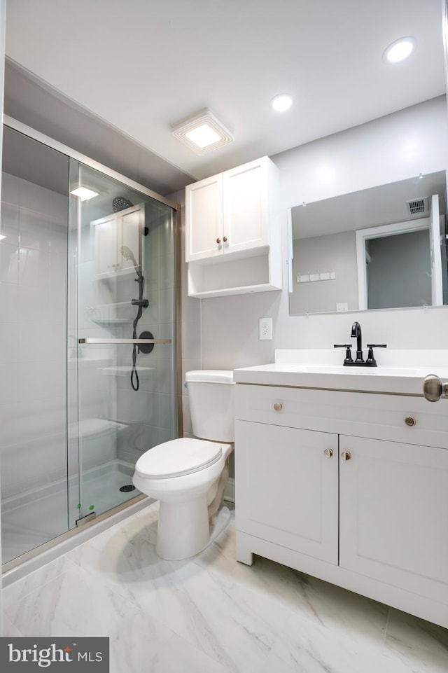 9704 Kingsbridge Dr Unit 203, Fairfax, VA 22031 - bathroom with vanity, a stall shower, marble look tiles, and recessed lighting