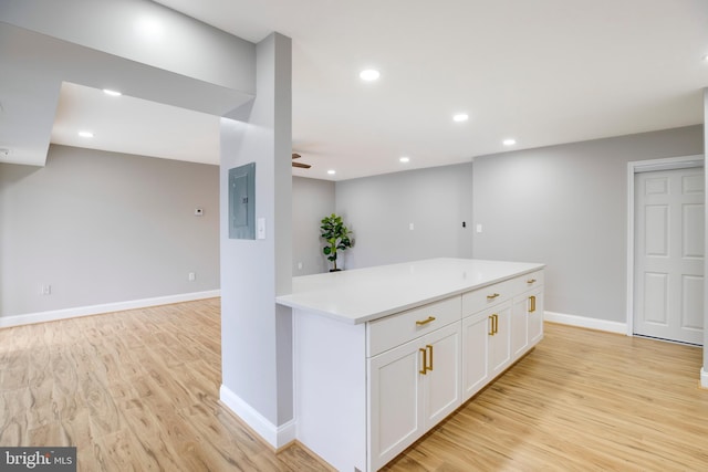 9704 Kingsbridge Dr Unit 203, Fairfax, VA 22031 - kitchen featuring light wood-style floors, white cabinets, a ceiling fan, electric panel, and recessed lighting