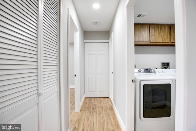 9704 Kingsbridge Dr Unit 203, Fairfax, VA 22031 - washroom featuring light wood-style floors and separate washer and dryer