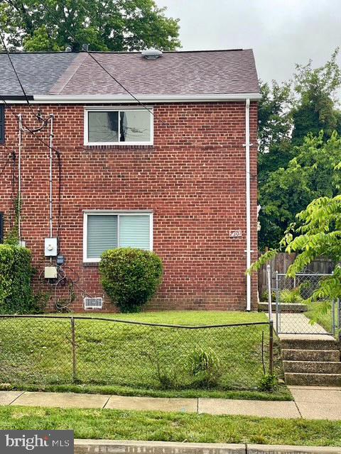 2301 Wyngate Rd, Suitland, MD 20746 - view of property exterior with brick siding and roof with shingles