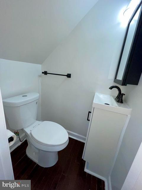 2301 Wyngate Rd, Suitland, MD 20746 - bathroom with vanity, wood finished floors, and lofted ceiling