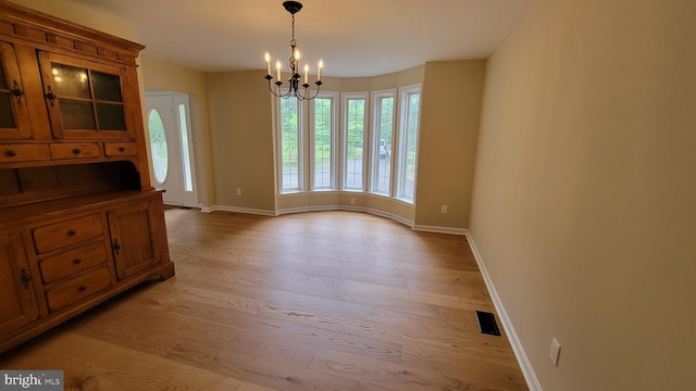 112 Pine Crest Ln, Gordonsville, VA 22942 - unfurnished dining area featuring light wood-style floors and a chandelier