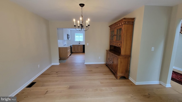 112 Pine Crest Ln, Gordonsville, VA 22942 - unfurnished dining area featuring a chandelier and light wood finished floors