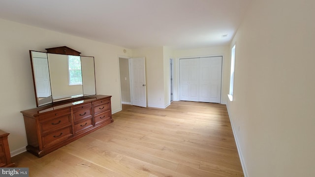 112 Pine Crest Ln, Gordonsville, VA 22942 - bedroom with light wood-style flooring, multiple windows, and a closet