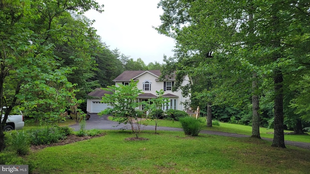 112 Pine Crest Ln, Gordonsville, VA 22942 - view of front of home featuring a front lawn and a garage