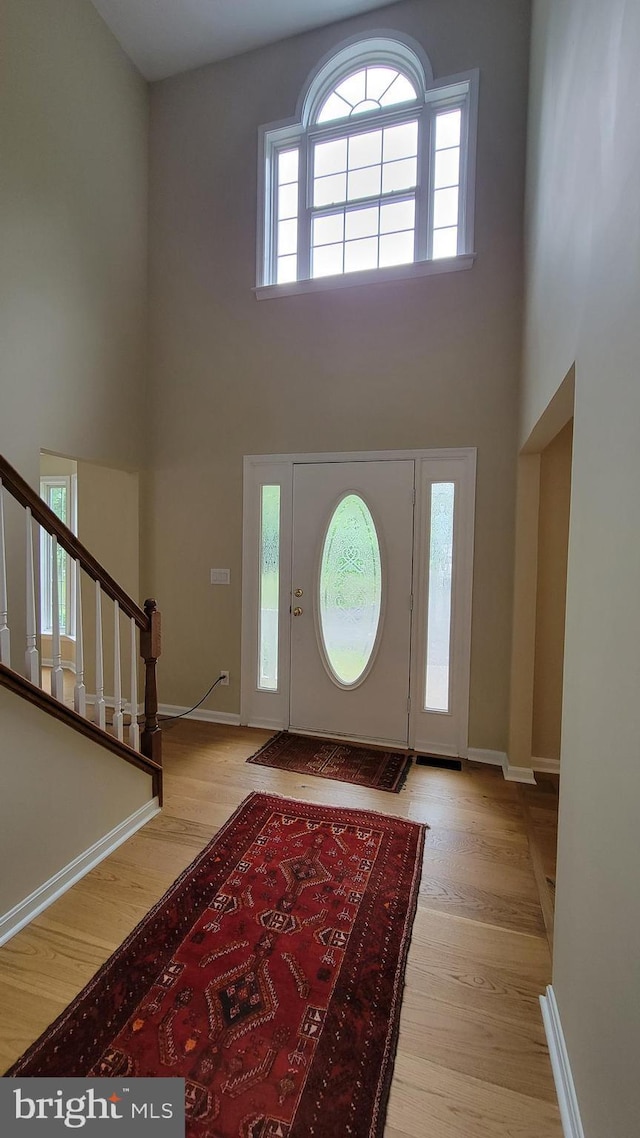 112 Pine Crest Ln, Gordonsville, VA 22942 - foyer entrance featuring a towering ceiling, wood finished floors, and stairway