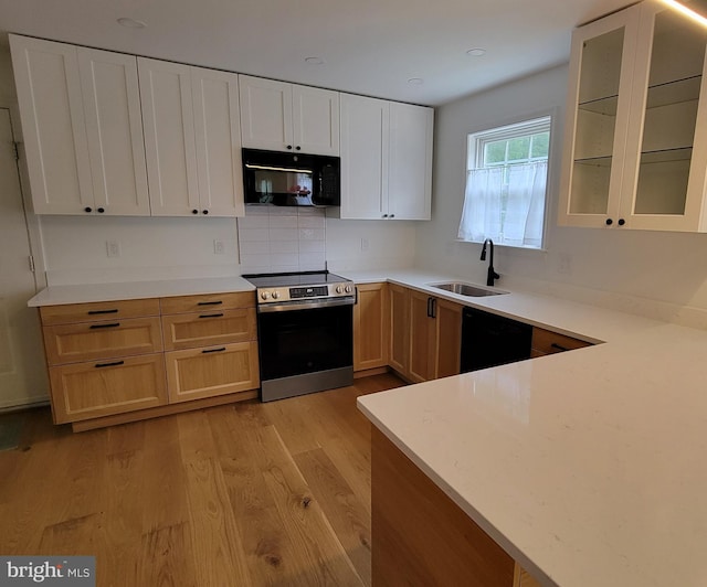 112 Pine Crest Ln, Gordonsville, VA 22942 - kitchen with black appliances, light wood-type flooring, glass insert cabinets, light countertops, and recessed lighting