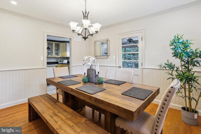 1407 Crestridge Dr, Silver Spring, MD 20910 - dining room with a wainscoted wall, a chandelier, light wood-type flooring, and ornamental molding